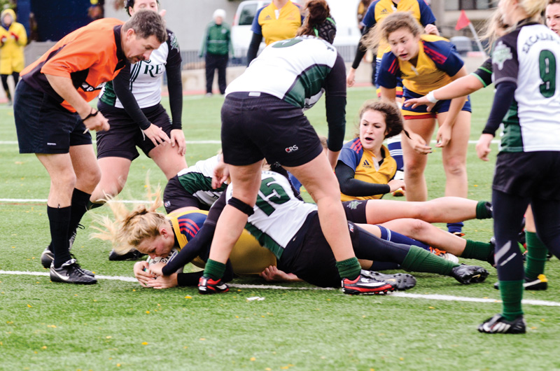 Forward Kayla Roote barely crosses the line to score a try as time expires in overtime.