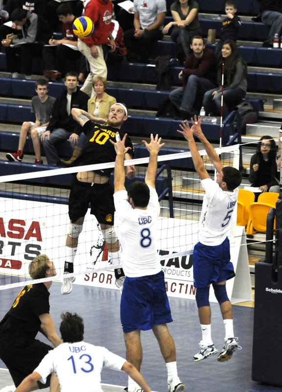 Alberta Golden Bears outsider hitter Taylor Hunt attempts a kill during the gold medal game at the ARC on Sunday.