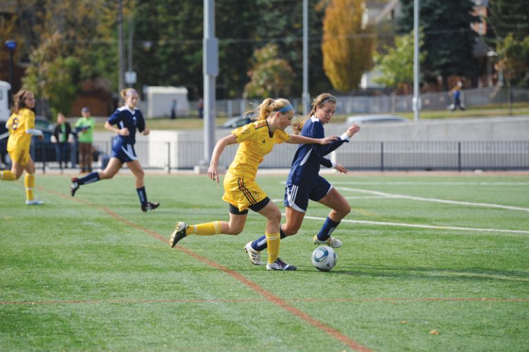 Striker Breanna Burton challanges a Nipissing Lakers' defender at Richardson Stadium on Saturday.