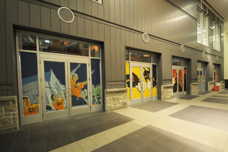 The current empty spaces in the Queen's Centre will be transformed to a grocery store and a pharmacy. They are set to open by the spring of 2012.
