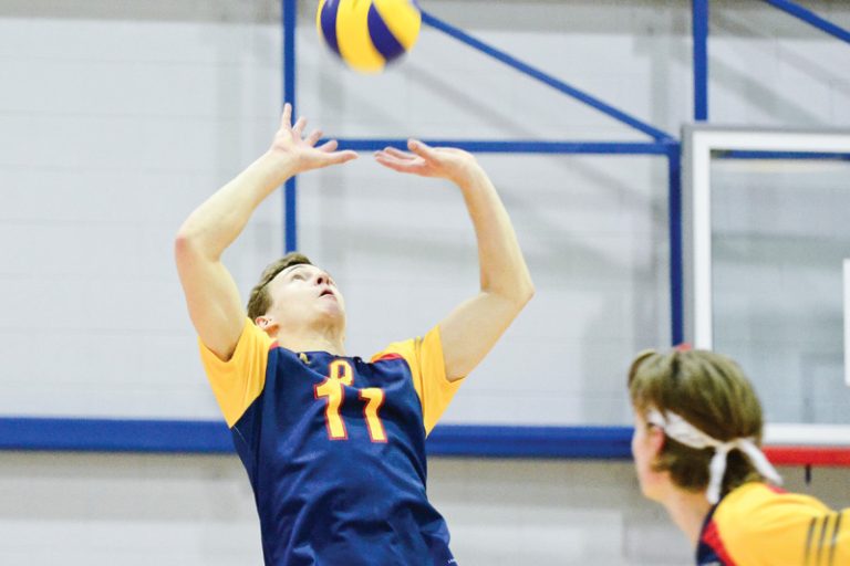 Rookie middle Tyler Scheerhoorn watches as setter Matt Bonshor places the ball. Bonshor finished the game with 26 assists.