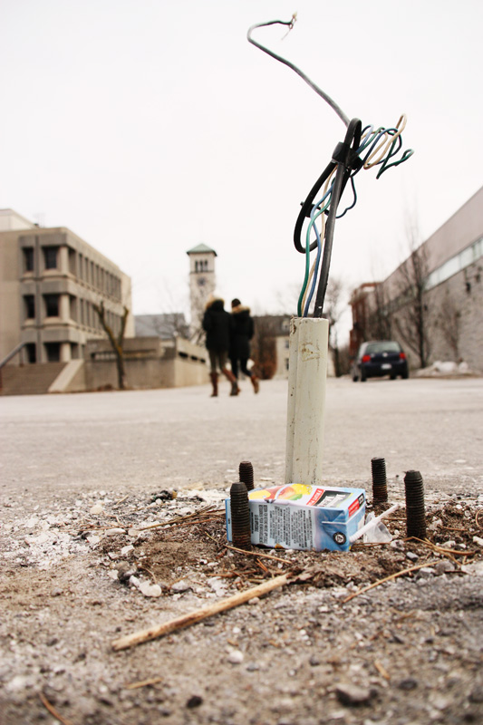 The blue light in front of Mac-Corry was knocked over by a snow plow last month.