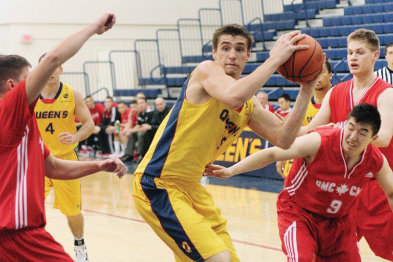 Gaels centre John Lenz brings down a rebound against the Royal Military College Paladins on Saturday night.