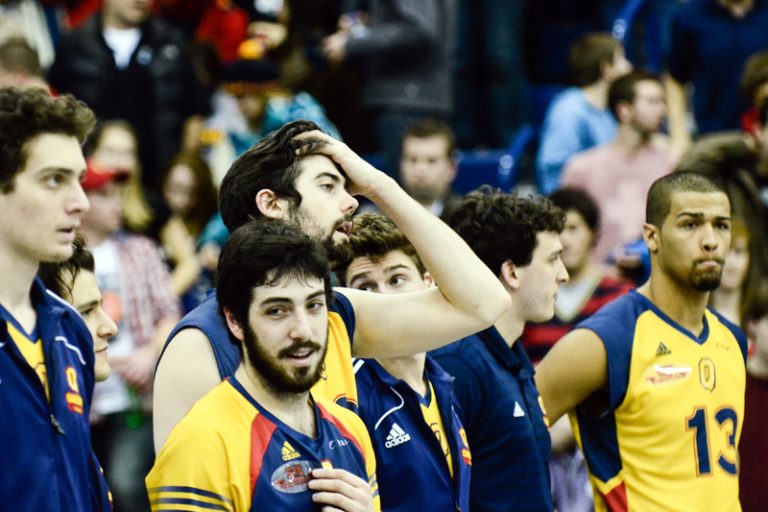 Queen's players line up for post-game awards after Saturday's semifinal loss to the Trinity Western Spartans.