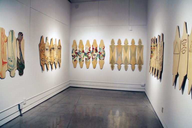 Anya Mielniczek’s In the Grain displays six groups of longboards she built herself.
