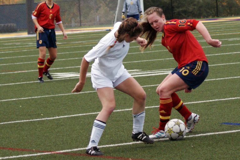 Midfielder Laura Callender battles for the ball against Trent.