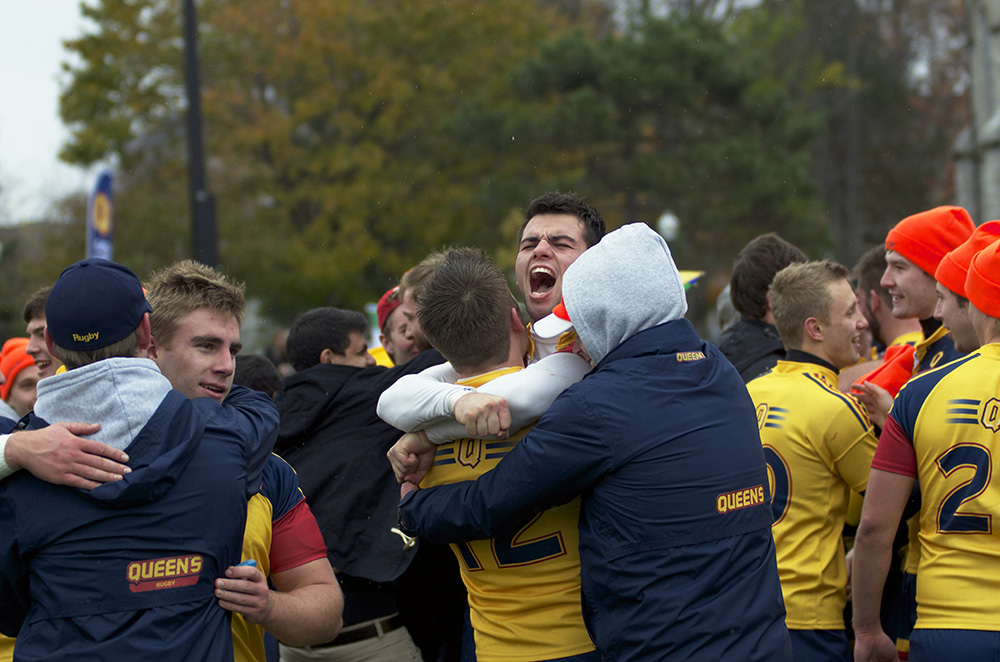 Fourth-year wing Graham Turner celebrated with his teammates after beating Western.