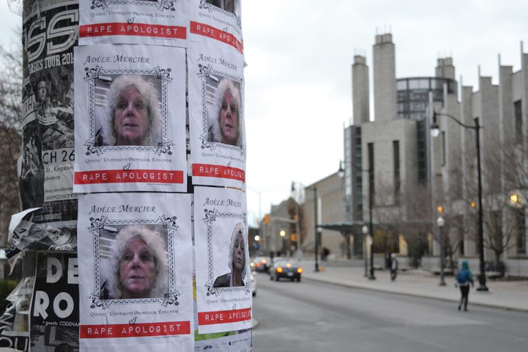 Posters accusing Adele Mercier of being a rape apologist are displayed around campus.