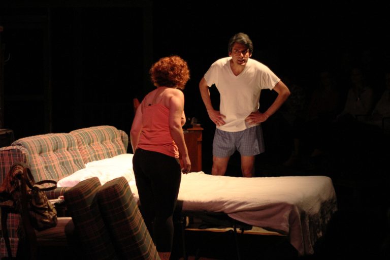 A disagreement between husband and wife breaks out on stage.
