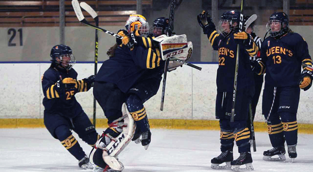 Stephanie Pascal (goalie) rejoices with teammates after Gaels’ 2-1 win over Nipissing.