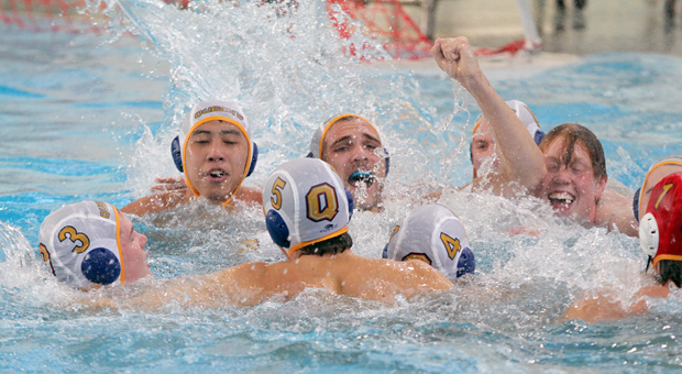 The water polo team celebrating their bronze medal in the ARC.