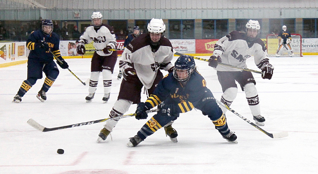Queen’s battles for the puck against St. Mary’s.