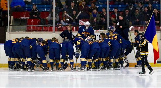 The women’s hockey team huddles prior to the game.