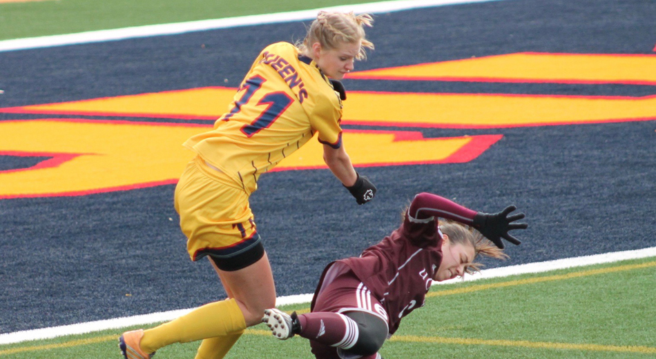 Tara Bartram battles the Gee Gees defender for the ball.