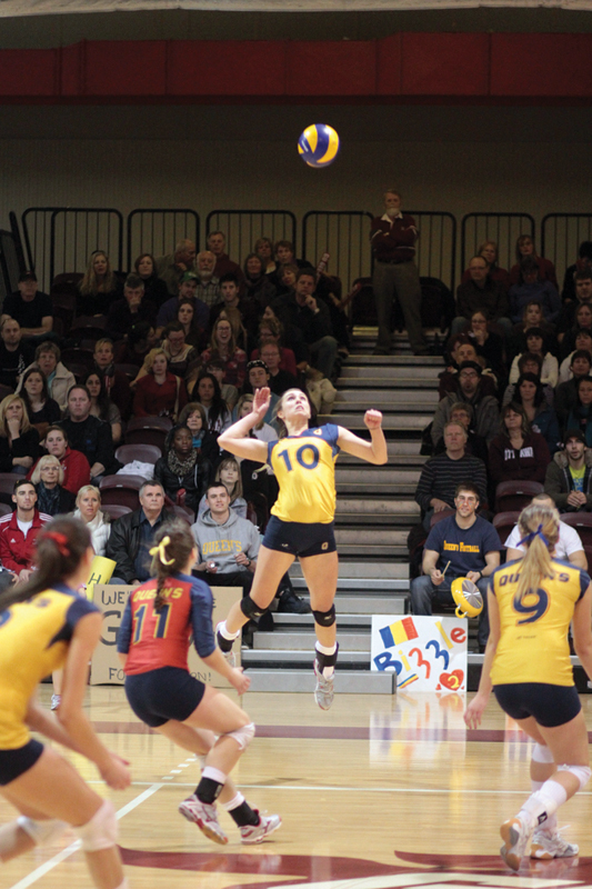 Outside hitter Becky Billings jumps to spike a ball during the Gaels’ win over the Ottawa Gee-Gees in Sunday’s OUA final.