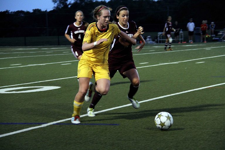 Ottawa native Laura Callender challenges for the ball against a Gee-Gees opponent.