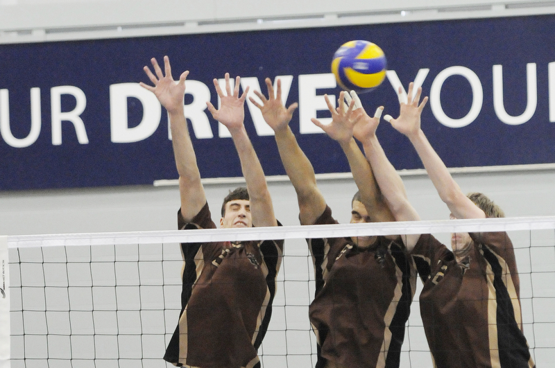 The Manitoba Bisons block a play at the 2012 CIS men's volleyball championship.