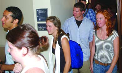 Student residents of Aberdeen Street exit a private meeting held yesterday by Principal Hitchcock