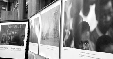 These photos on exhibit in Stauffer Library are meant to illustrate the experiences of people with AIDS.