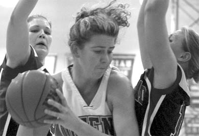 Amy Goodday sandwiched between two defenders.