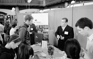 Students and prospective employers meet and greet at a Career Fair in Grant Hall yesterday.