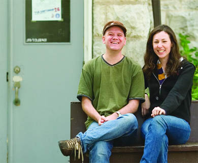 CFRC music co-ordinator Scott Stevens and business manager Joanne Williams sit in front of the entrance to the station’s headquarters