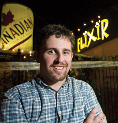 Chris Morris stands in front of Elixir
