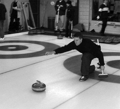 The intramural curling league hits the ice at the Royal Kingston Curling Club in 2002.