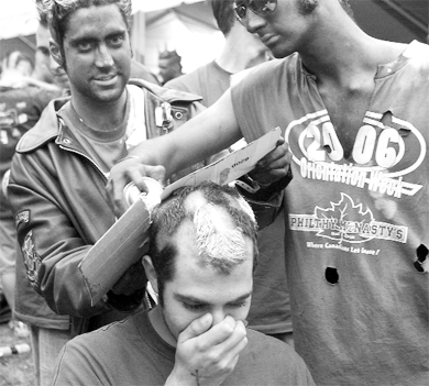 Engineering frosh receive their traditional haircuts in Agnes Benidickson Park.