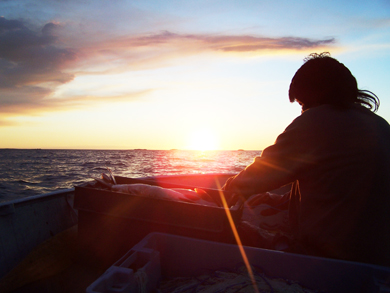 A fisherman from K.I. loads his catch. (Photo courtesy of bigtroutlake.firstnation.ca.)