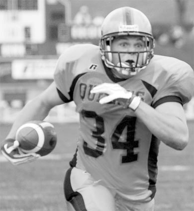 Fullback Mike Giffen charges towards the end zone on his way to a touchdown.