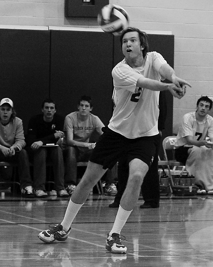 Gael Jeff DeMeza (2) goes for a dig as Pete Galbraith looks on.