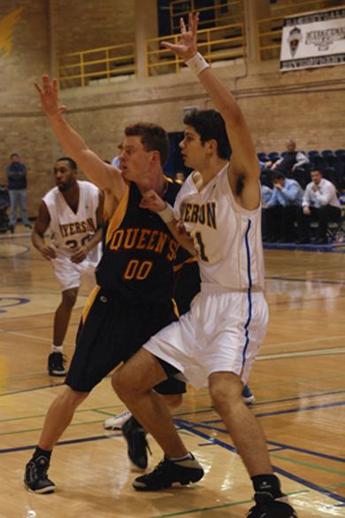 Gaels’ forward Jon Ogden (00) tries to get open against Ryerson’s Igor Bakovic Friday.