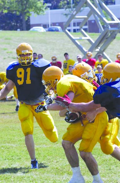 Gaels players run full-contact drills during a training camp practice.