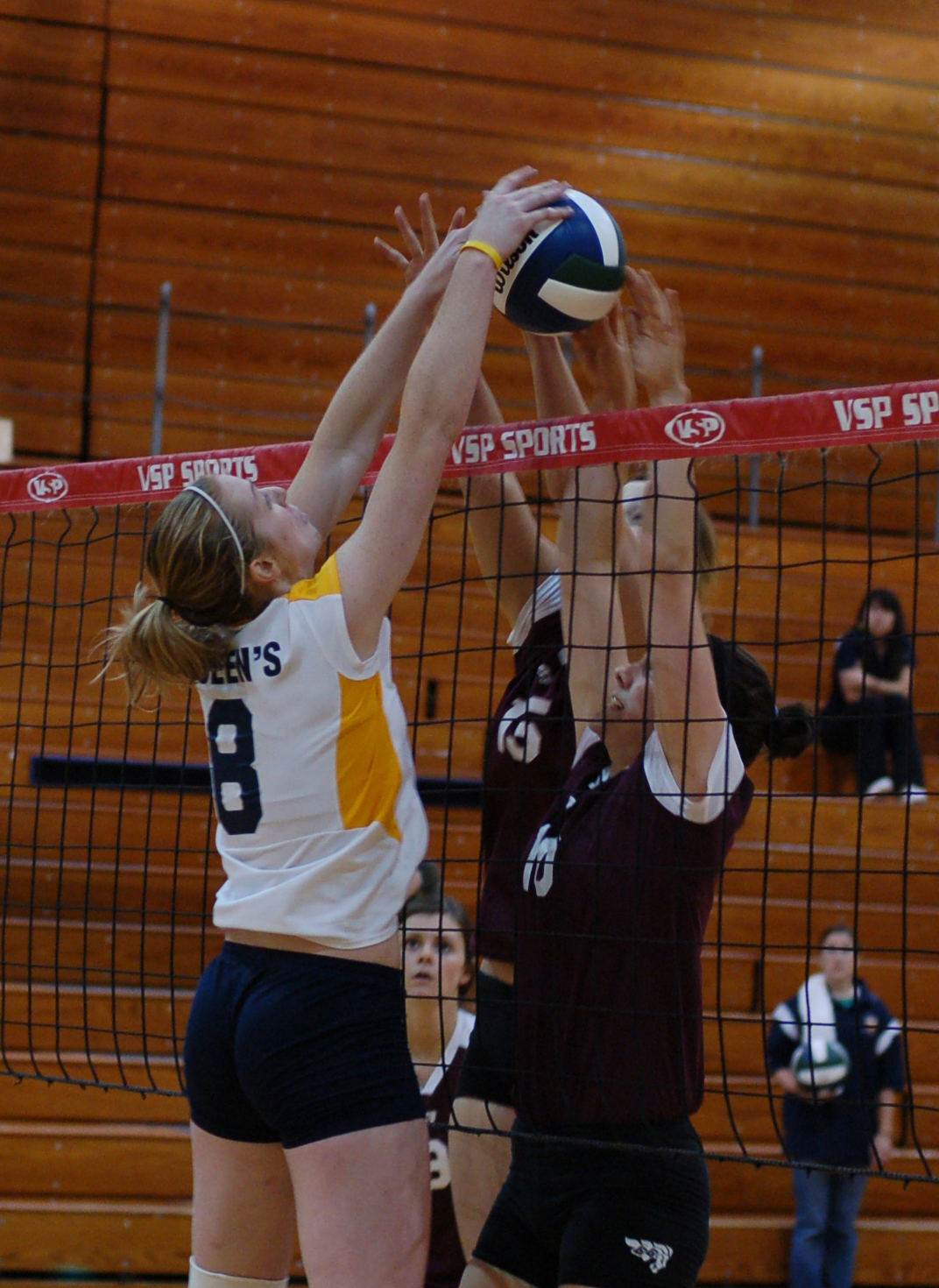 Gaels’ right-side hitter Lisa Cooke blocks an Ottawa attacker in Friday’s game.