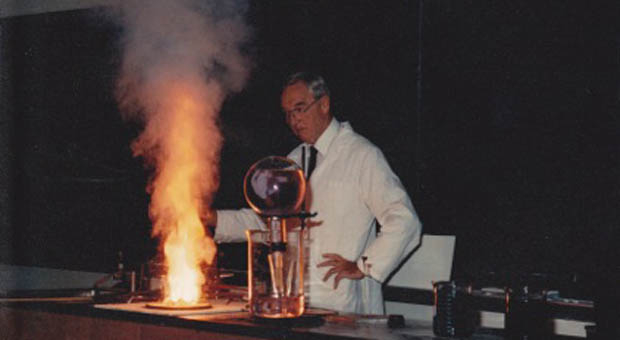 K.E. Russell conducting a demonstration for his students during one of his chemistry classes.