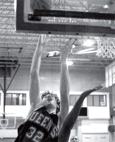 Mitch Leger is fouled while scoring the tying basket in Saturday’s win over the Gee-Gees.