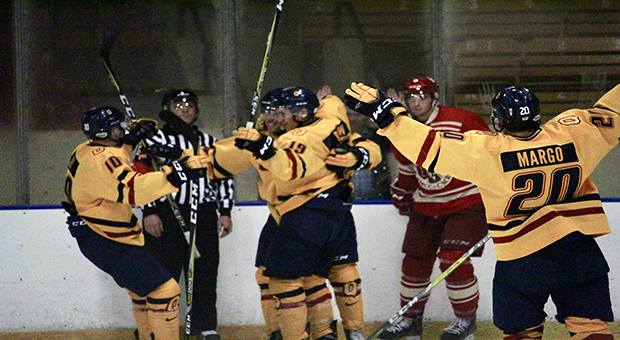 Forward Eric Margo celebrates with teammates against RMC last Wednesday.