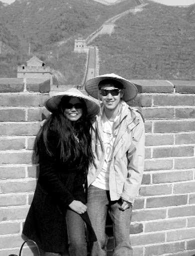Maria Carvalho and Dave Grant stop for a photo as they climb the Great Wall of China.
