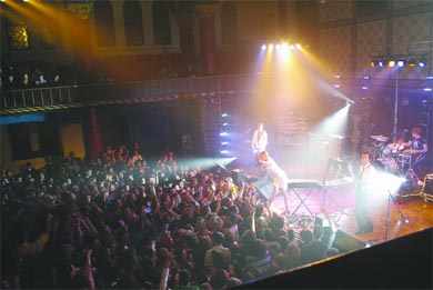 Crowd members pumped their fists for Metric at its second appearance this year on Tuesday night at Grant Hall.