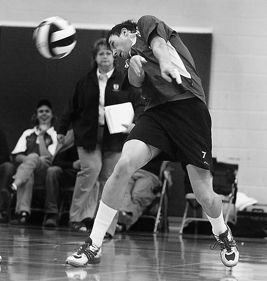Gaels’ middle hitter Chris Vandyk unsuccessfully tries to dig a ball Saturday.