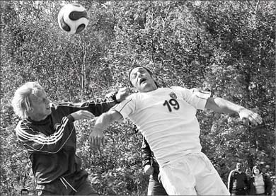 Nick Milonas (19) challenges a Laurentian defender for the ball Sunday.
