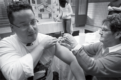 Dean of Student Affairs Jason Laker got a flu shot in Victoria Hall Wednesday in order to promote shots for students. Students can get vaccinated next week at HCDS if they bring their student card and health card.