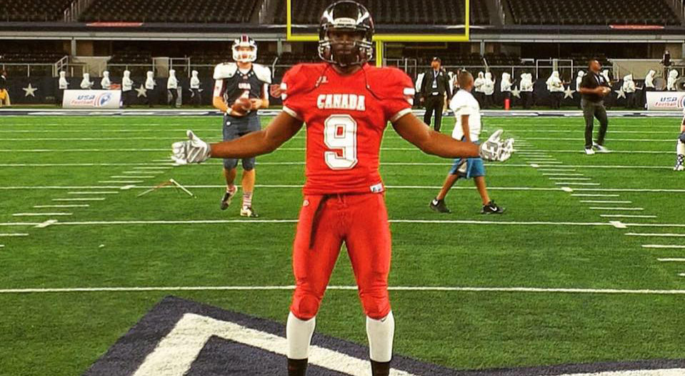 Chris Osei-Kusi poses at midfield of AT&T Stadium.