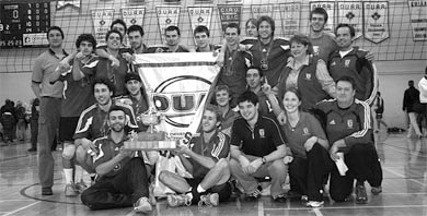 Men’s volleyball celebrates their OUA championship in Bartlett Gym.