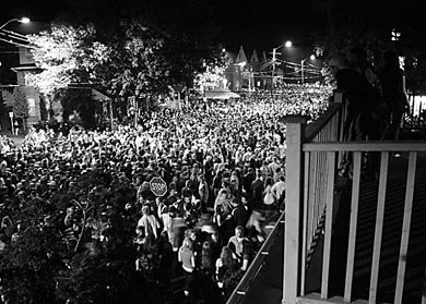 Partygoers gather on Aberdeen Street for Homecoming 2006.