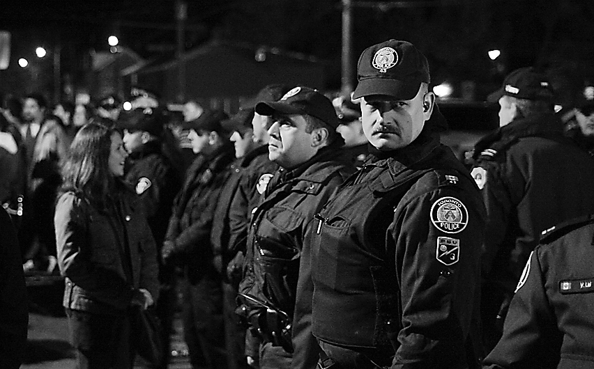 Police officers patrol Aberdeen Street on Saturday of Homecoming weekend.