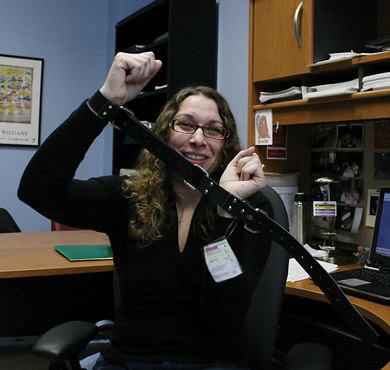 Psychology professor Caroline Pukall demonstrates the use of a trick belt.