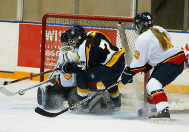 Queen’s goalie Katie Boyd challenges Windsor forward Candace Rapchak with defender Katie Duncan in pursuit. The Gaels lost to the Lancers 3-1 on Saturday.
