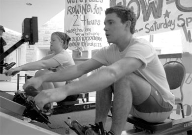 Queen’s rowers count down as they pull towards the final hours of their 24-hour row-a-thon in the JDUC.
